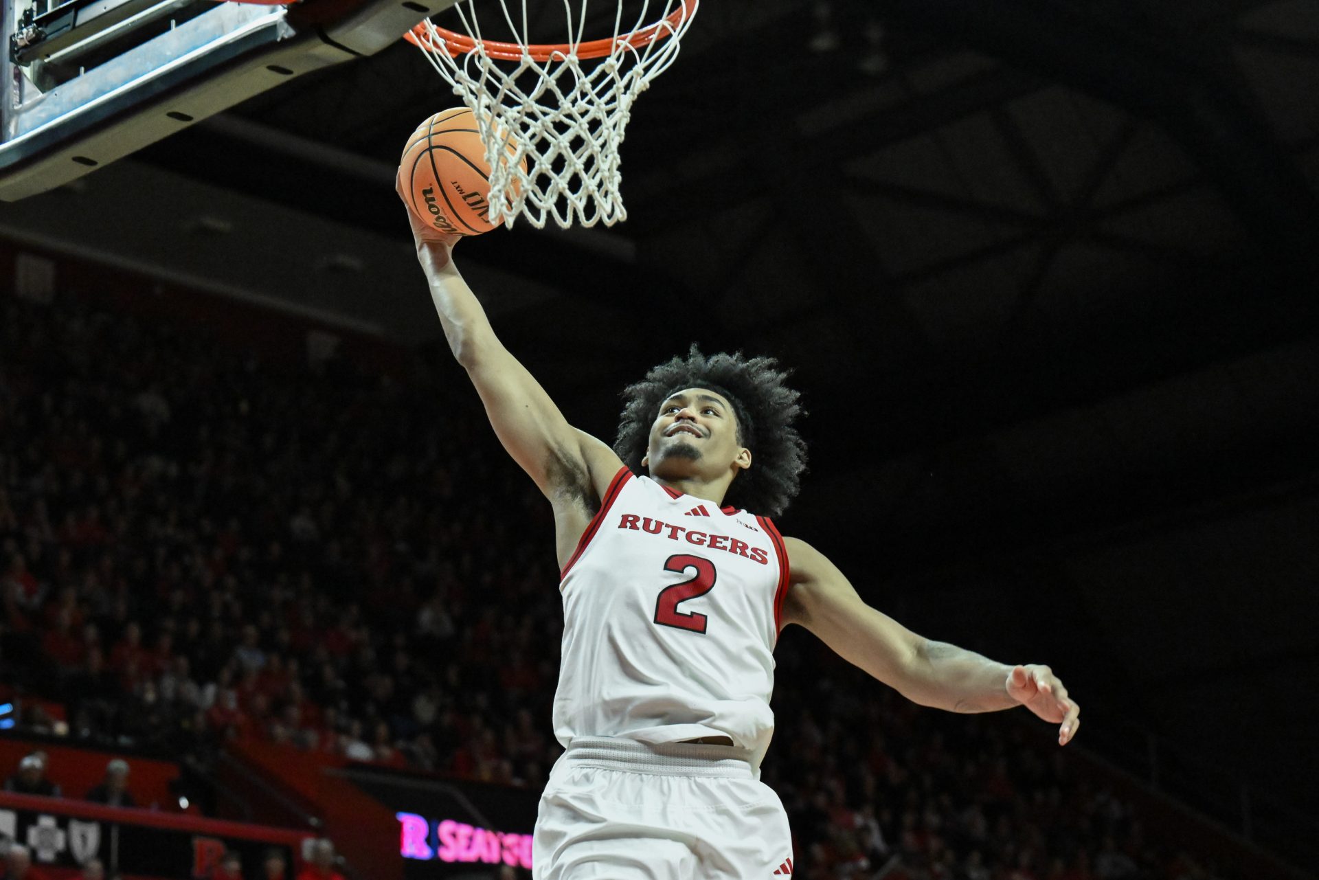 Rutgers Scarlet Knights guard Dylan Harper (2) dunks the ball during the second half against the USC Trojans at Jersey Mike's Arena.