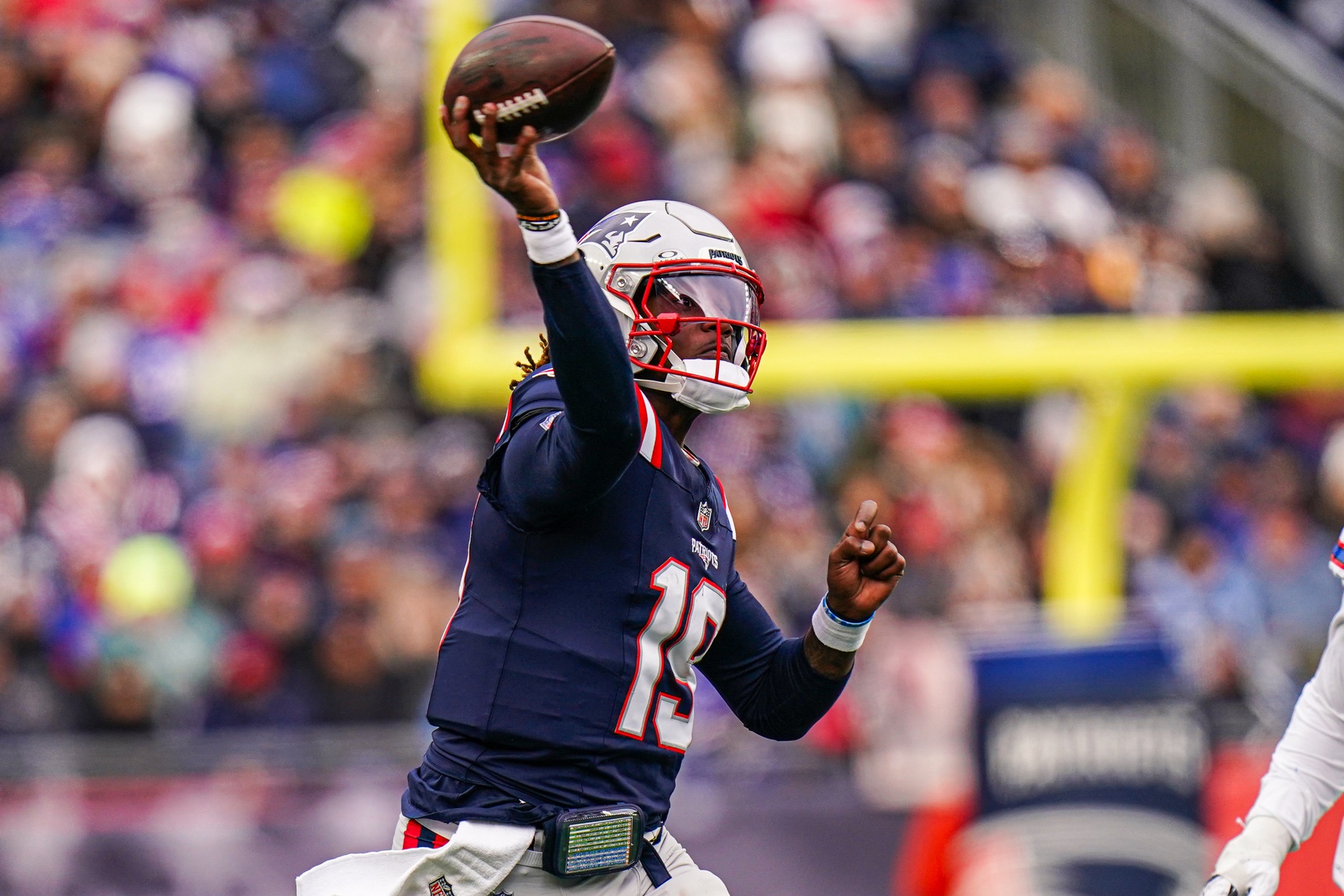 New England Patriots quarterback Joe Milton III (19) throws a pass against the Buffalo Bills in the first half at Gillette Stadium.