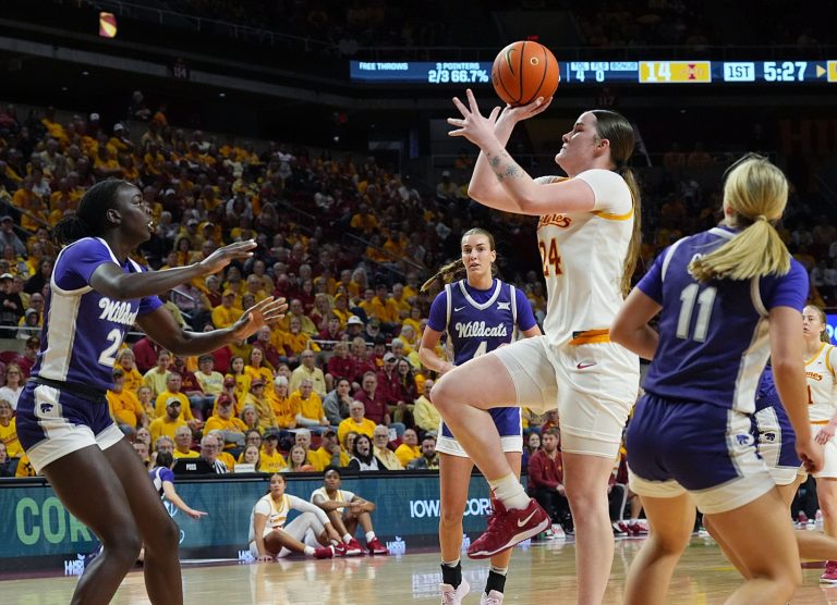 Iowa State Cyclones' forward Addy Brown (24) shoots the ball between Kansas State Wildcats forward Eliza Maupin (21) and guard Taryn Sides (11) during the first quarter in the Big-12 women’s basketball at Hilton Coliseum on Sunday, March 2, 2025, in Ames, Iowa.