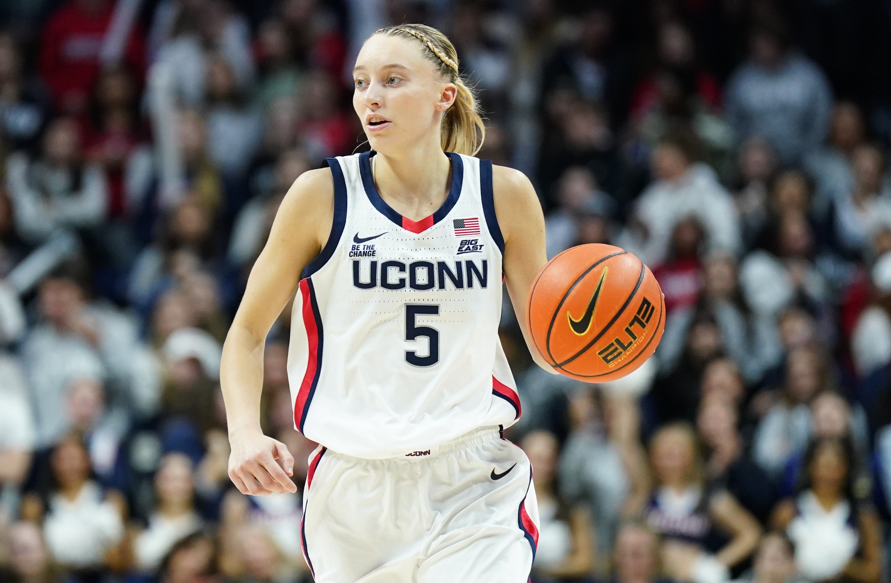 UConn Huskies guard Paige Bueckers (5) returns the ball against the Holy Cross Crusaders in the second half at Harry A. Gampel Pavilion.