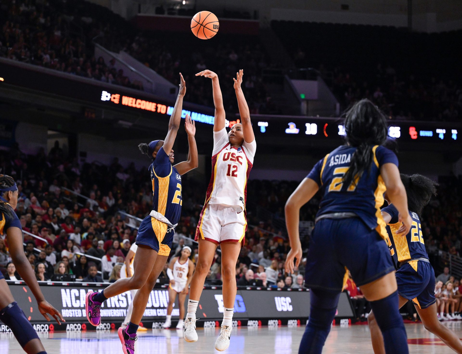 USC Trojans guard JuJu Watkins (12) shoots over UNC Greensboro Spartans guard Nya Smith (22) during the second quarter of an NCAA Tournament game at Galen Center.