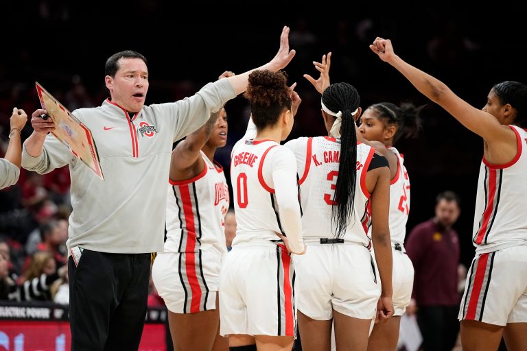 Ohio State Buckeyes head coach Kevin McGuff breaks the huddle during a timeout with his team during the second half of the NCAA women's basketball game against the Minnesota Golden Gophers at Value City Arena in Columbus on Feb. 13, 2025. Ohio State won 87-84 in overtime.