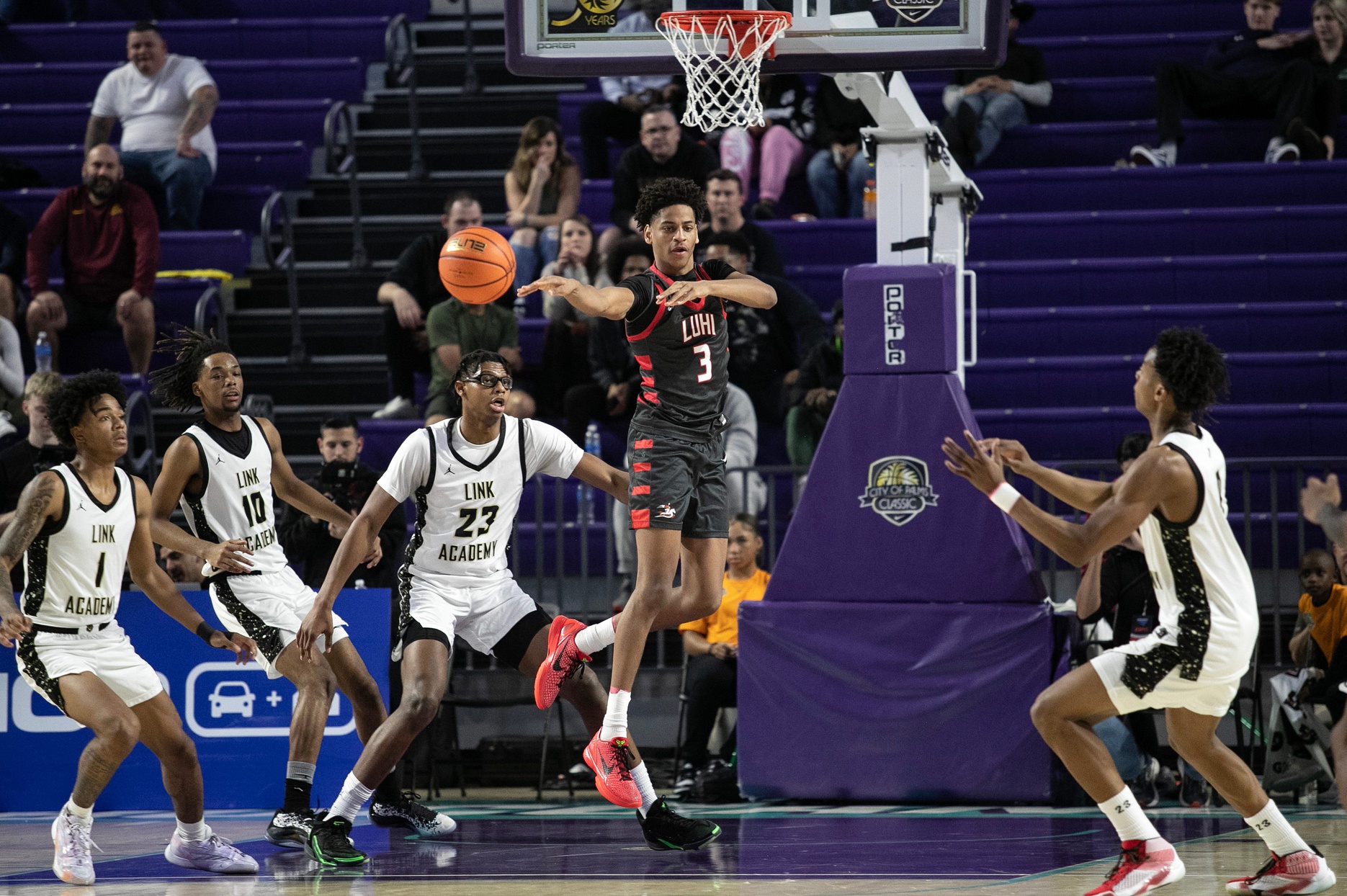 Kiyan Anthony of Long Island Lutheran makes a pass against Link Academy in the second semifinal matchup in the City of Palms Classic on Friday, Dec. 22, 2023 at Suncoast Credit Union Arena in Fort Myers.