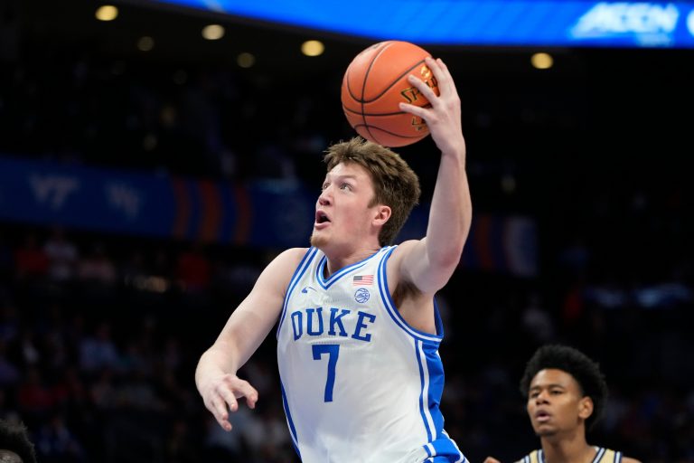 Duke Blue Devils guard Kon Knueppel (7) shoots in the first half at Spectrum Center.