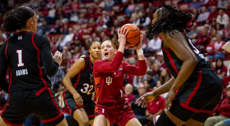 Indiana's Lexus Bargesser (1) looks to pass out of a triple teamduring the Indiana versus Rutgers women's basketball game at Simon Skjodt Assembly Hall on Thursday, Feb. 6, 2025.