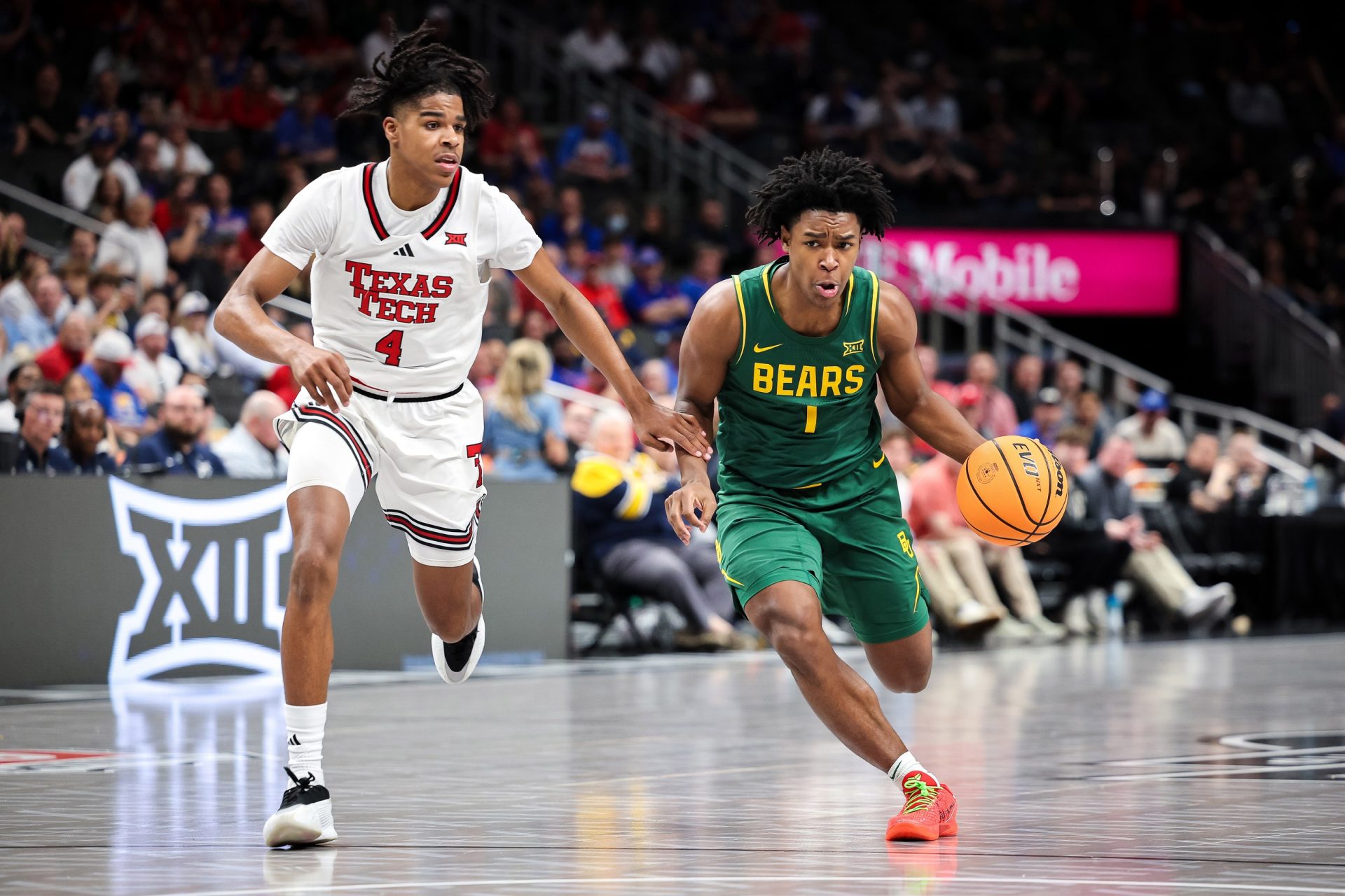 Baylor Bears guard Robert Wright III (1) dribbles the ball around Texas Tech Red Raiders guard Christian Anderson (4) during the second half at T-Mobile Center.