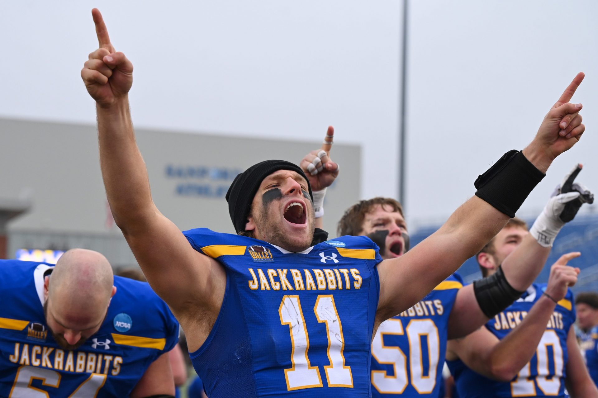 South Dakota State quarterback Mark Gronowski (11) cheers after singing the victory song on Saturday, Dec. 14, 2024, at Dana J. Dykhouse Stadium in Brookings.