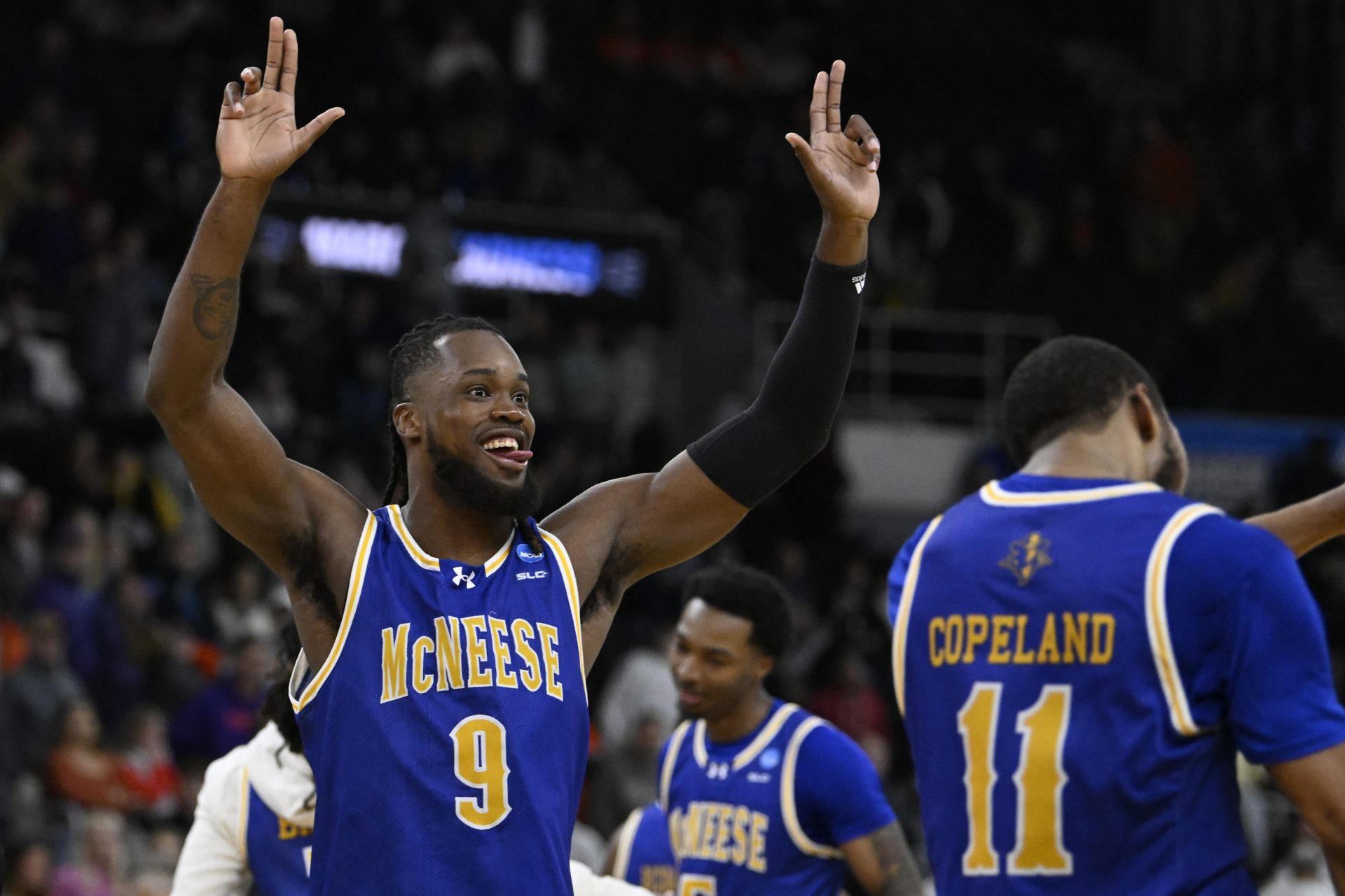 McNeese State Cowboys forward Christian Shumate (24) celebrates with teammates after defeating the Clemson Tigers at Amica Mutual Pavilion.