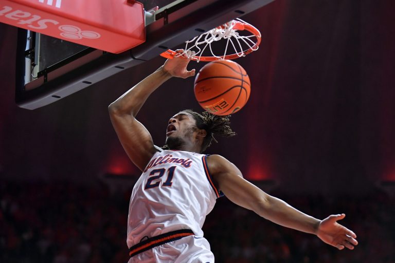 Illinois Fighting Illini forward Morez Johnson Jr. (21) dunks the ball during the first half against the Michigan State Spartans at State Farm Center.