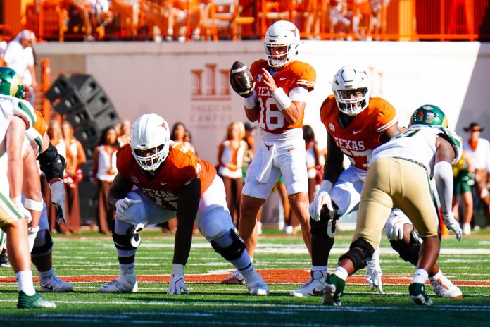 Texas Longhorns quarterback Arch Manning (16) receives the snap against the Colorado State Rams during the second half at Darrell K Royal-Texas Memorial Stadium.