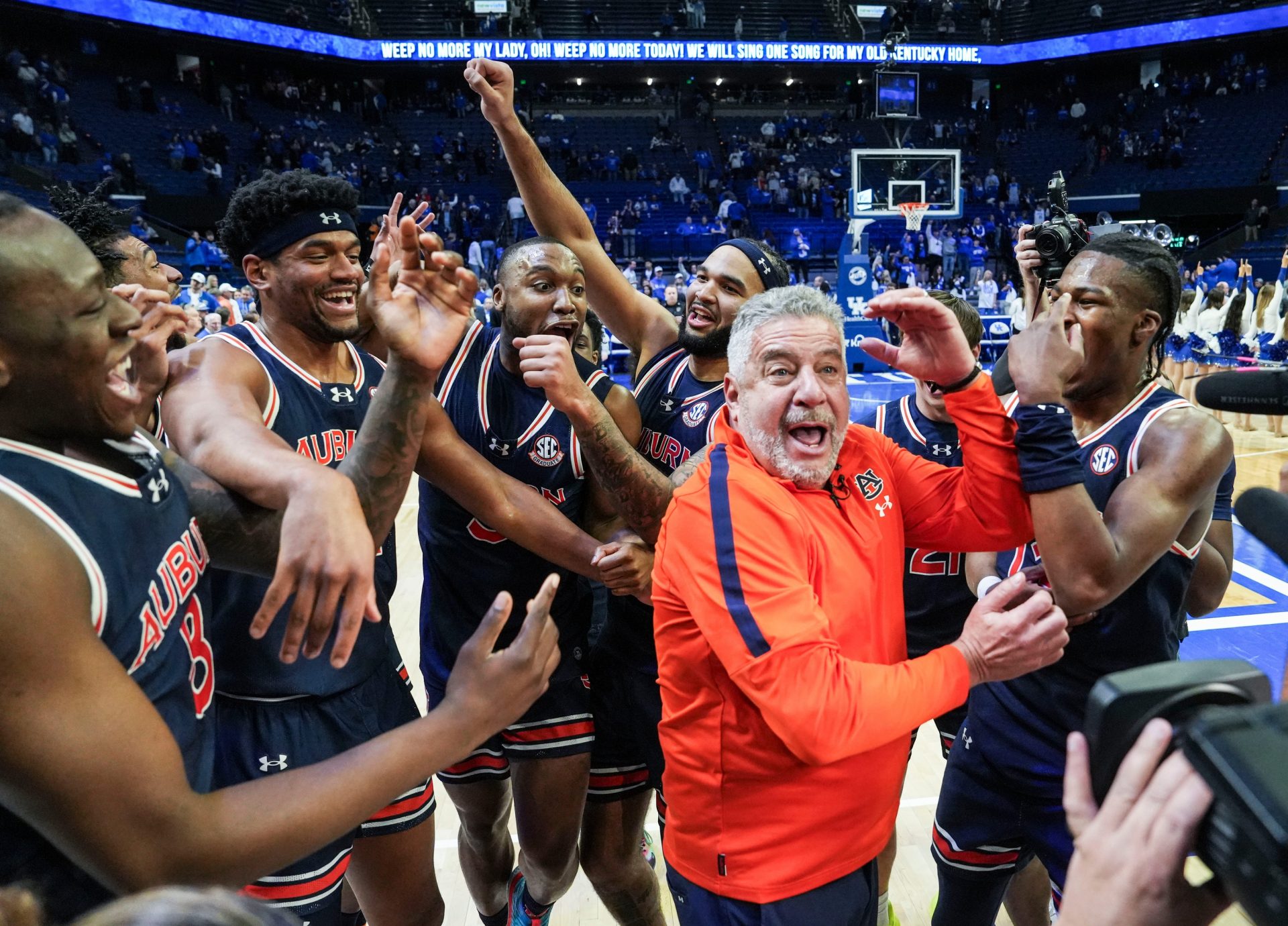 Auburn head coach Bruce Pearl and his No.1 Tigers celebrate after 94-78 win over Kentucky -- the first win at Rupp Arena since 1988 in SEC basketball Saturday afternoon in Lexington, Kentucky March 1, 2025