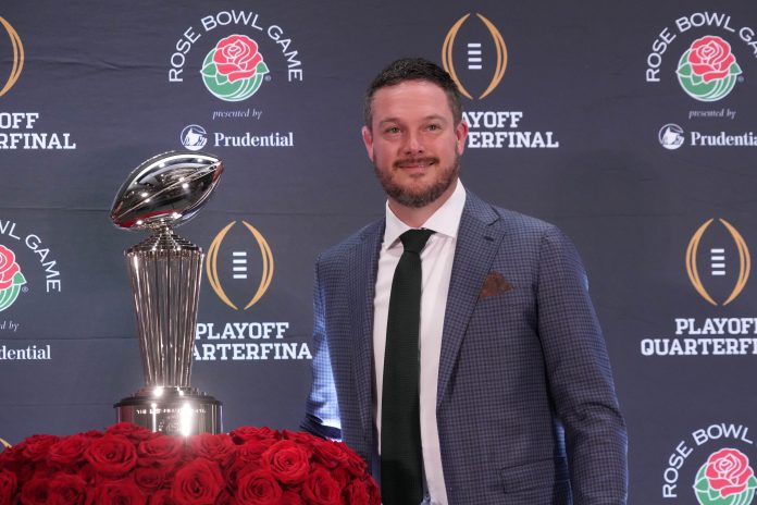 Oregon Ducks head coach Dan Lanning poses with the Leishman Trophy during the Rose Bowl head coaches press conference at Sheraton Grand LA.