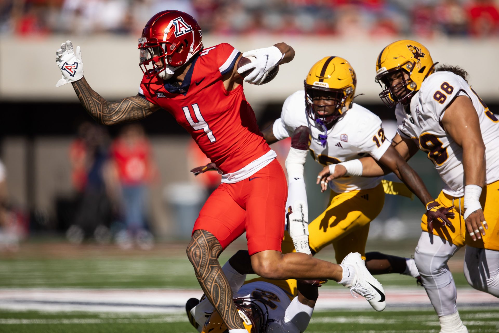 Arizona Wildcats wide receiver Tetairoa McMillan (4) against the Arizona State Sun Devils in the first half during the Territorial Cup at Arizona Stadium.