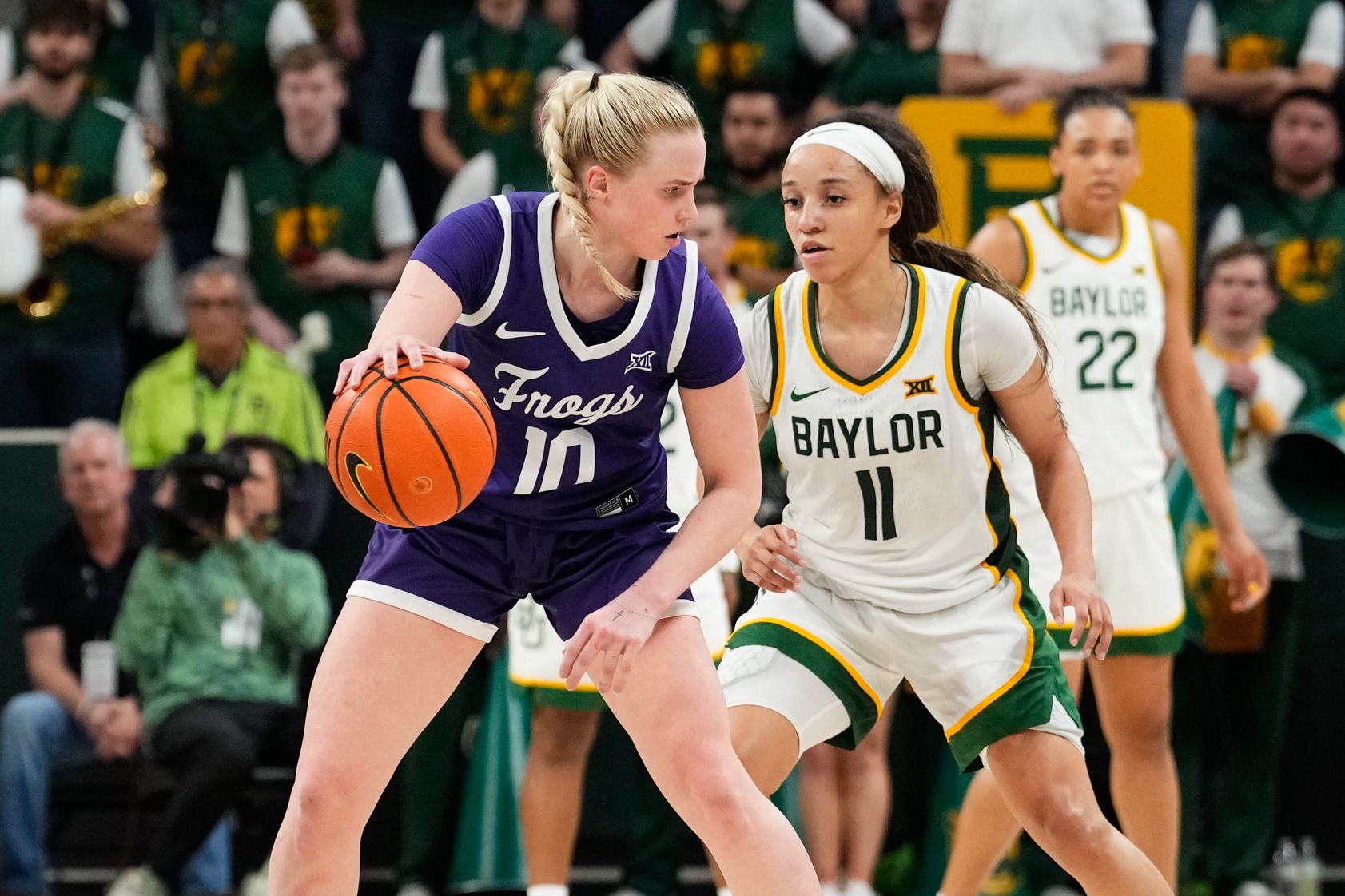 TCU Horned Frogs guard Hailey Van Lith (10) controls the ball as Baylor Lady Bears guard Jada Walker (11) defends during the second half at Paul and Alejandra Foster Pavilion.