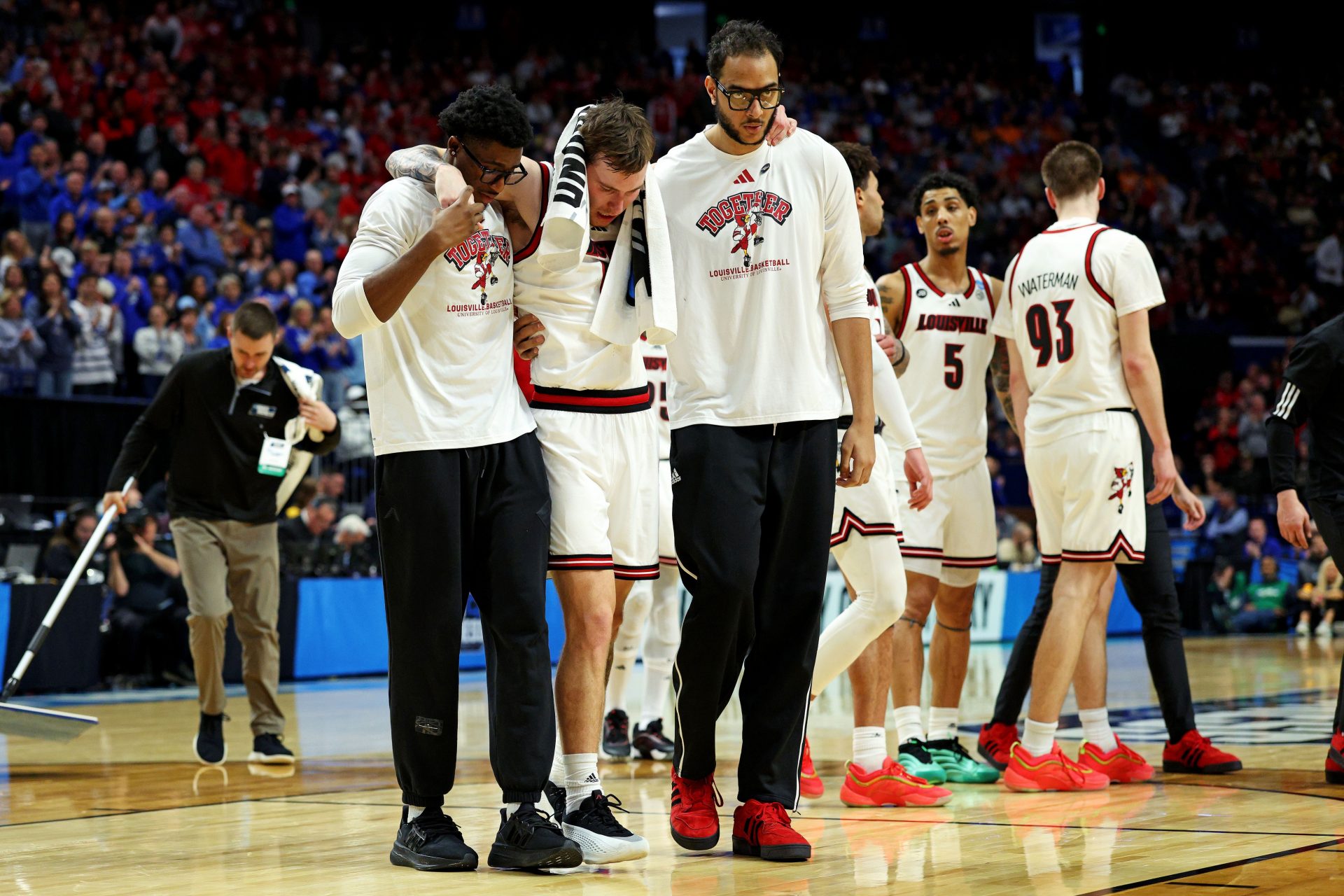 Louisville Cardinals guard Reyne Smith (6) is helped off the court after being injured during the second half against the Louisville Cardinals in the first round of the NCAA Tournament at Rupp Arena.