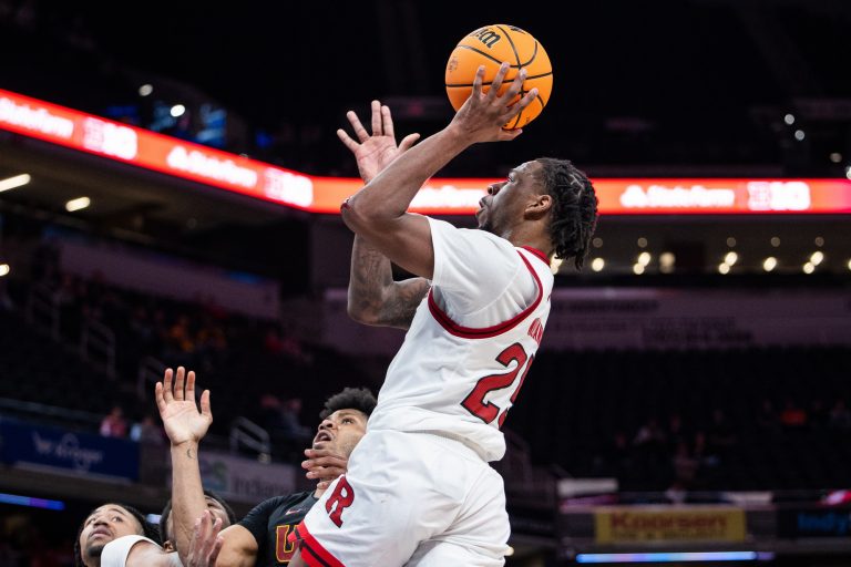 Rutgers Scarlet Knights center Lathan Sommerville (24) shoots the ball while USC Trojans guard Chibuzo Agbo (7) defends in the second half at Gainbridge Fieldhouse.