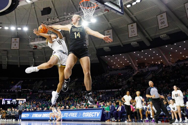 Wake Forest guard Rylie Theuerkauf (14) fouls Notre Dame guard Cassandre Prosper (8) during a NCAA women's basketball game between No. 3 Notre Dame and Wake Forest at Purcell Pavilion on Thursday, Jan. 9, 2025, in South Bend.