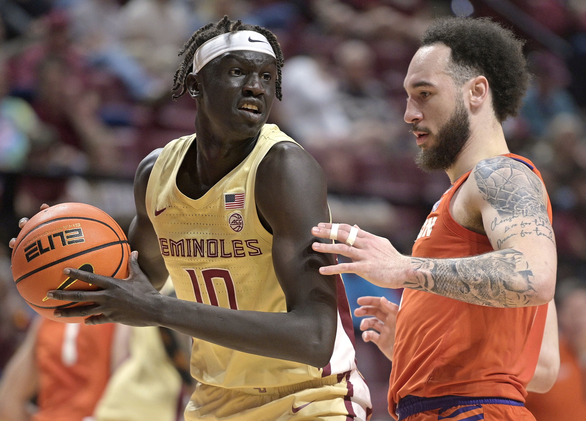 Clemson Tigers guard Jaeden Zackery (11) defends Florida State Seminoles forward Taylor Bol Bowen (10) during the second half at Donald L. Tucker Center.