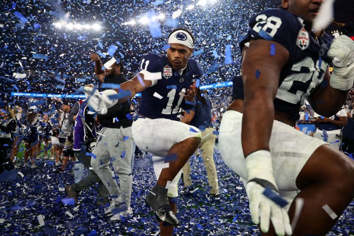 Penn State Nittany Lions defensive end Abdul Carter (11) reacts with teammates after defeating the Boise State Broncos in the Fiesta Bowl at State Farm Stadium.