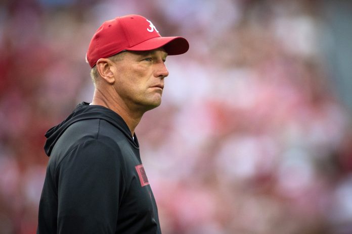 Alabama Crimson Tide head coach Kalen DeBoer watches warm ups on the field before a game against the Georgia Bulldogs at Bryant-Denny Stadium.