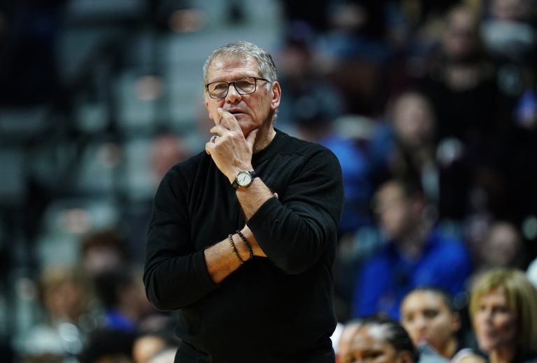UConn Huskies head coach Geno Auriemma watches from the sideline as they take on the St. John's Red Storm at Mohegan Sun Arena.