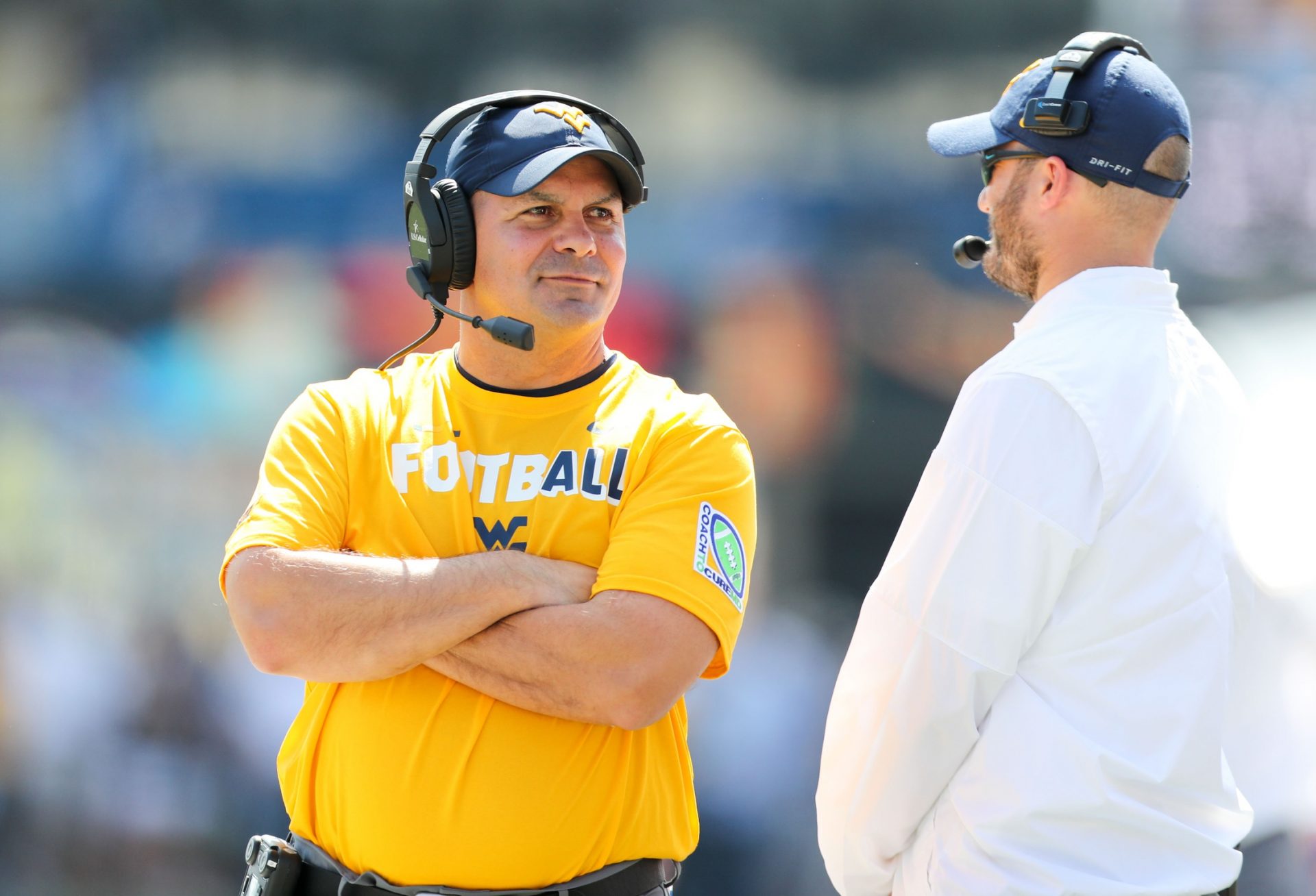 West Virginia Mountaineers defensive coordinator Tony Gibson walks along the sidelines during the first quarter against the Delaware State Hornets at Milan Puskar Stadium.