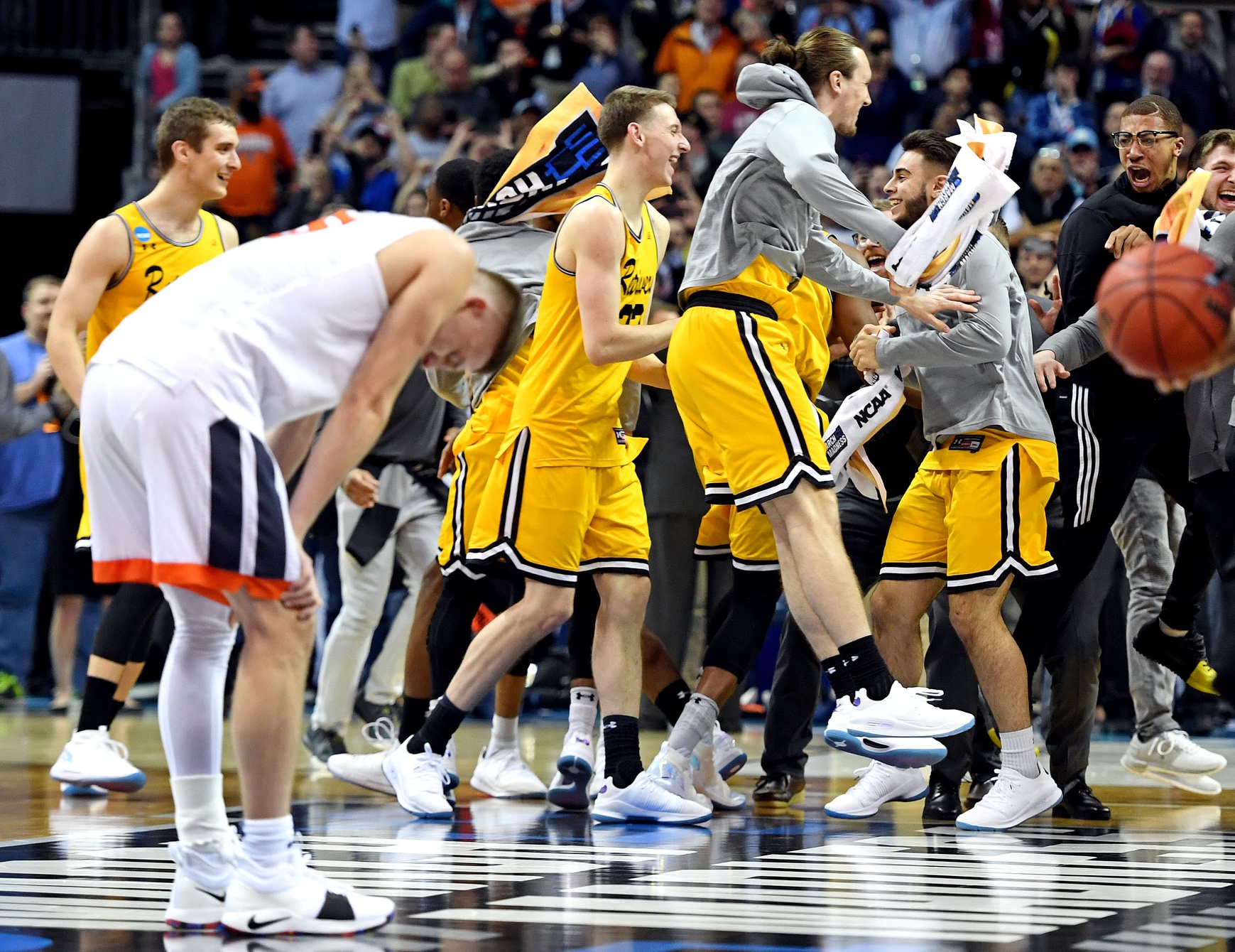 UMBC Retrievers celebrates after the Virginia Cavaliers in the first round of the 2018 NCAA Tournament at Spectrum Center.