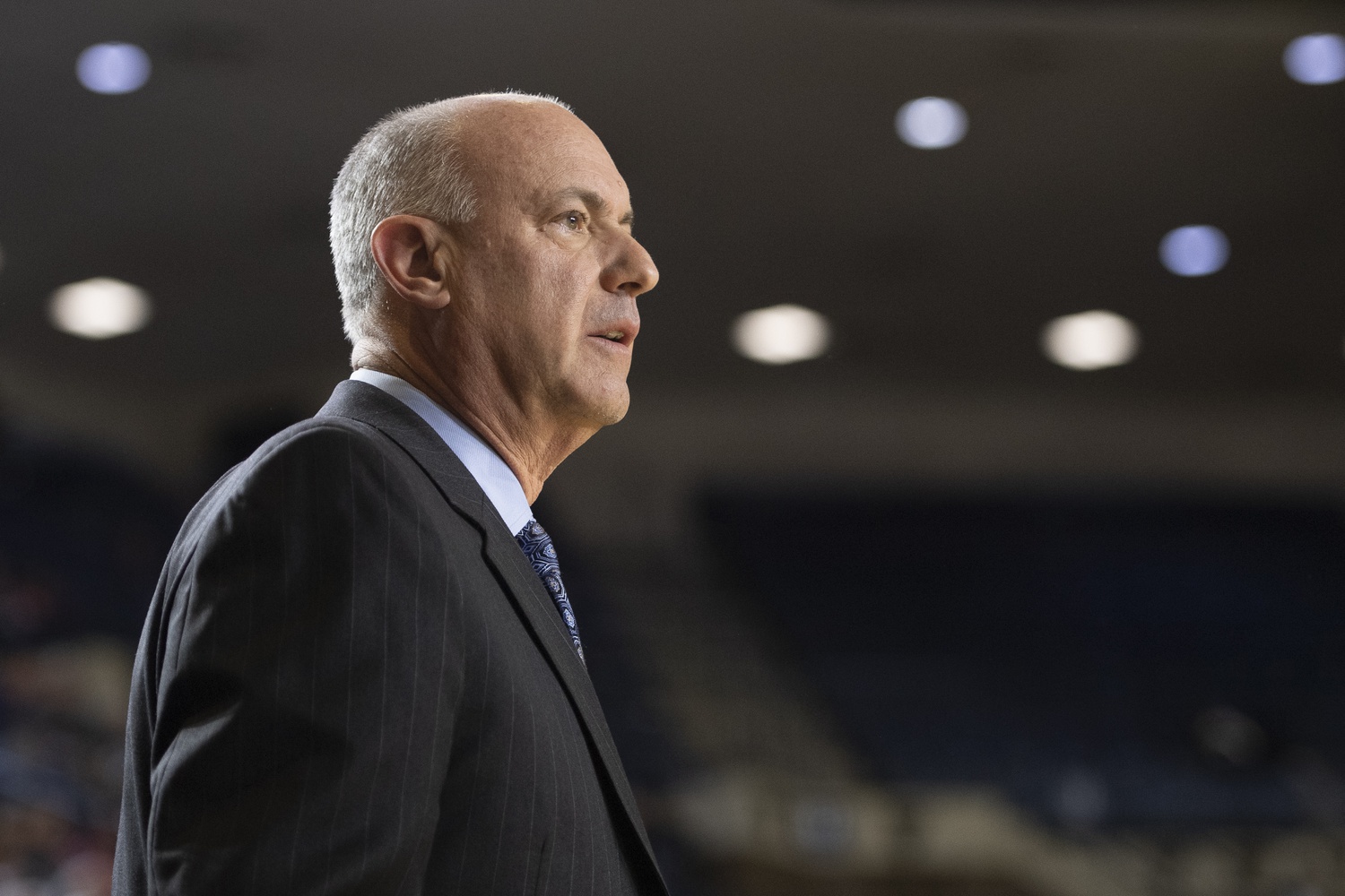 Navy Midshipmen head coach Ed DeChellis looks onto the court during the first half against the East Carolina Pirates at Alumni Hall.