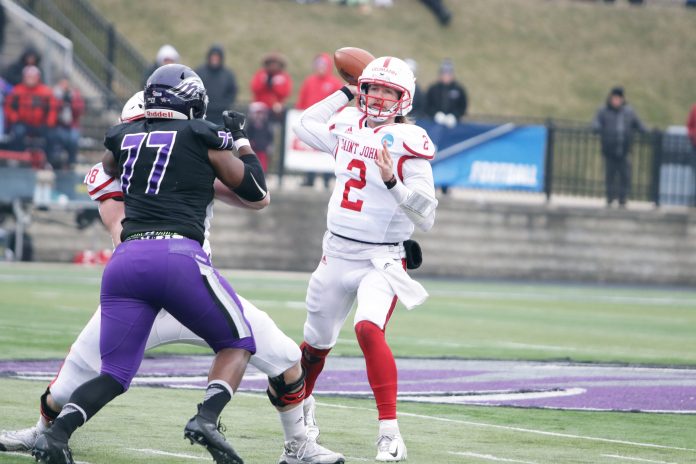 Saint John's senior quarterback Jackson Erdmann tosses a pass during the Johnnies 35-32 semifinal loss to UW-Whitewater on Saturday, Dec. 14.