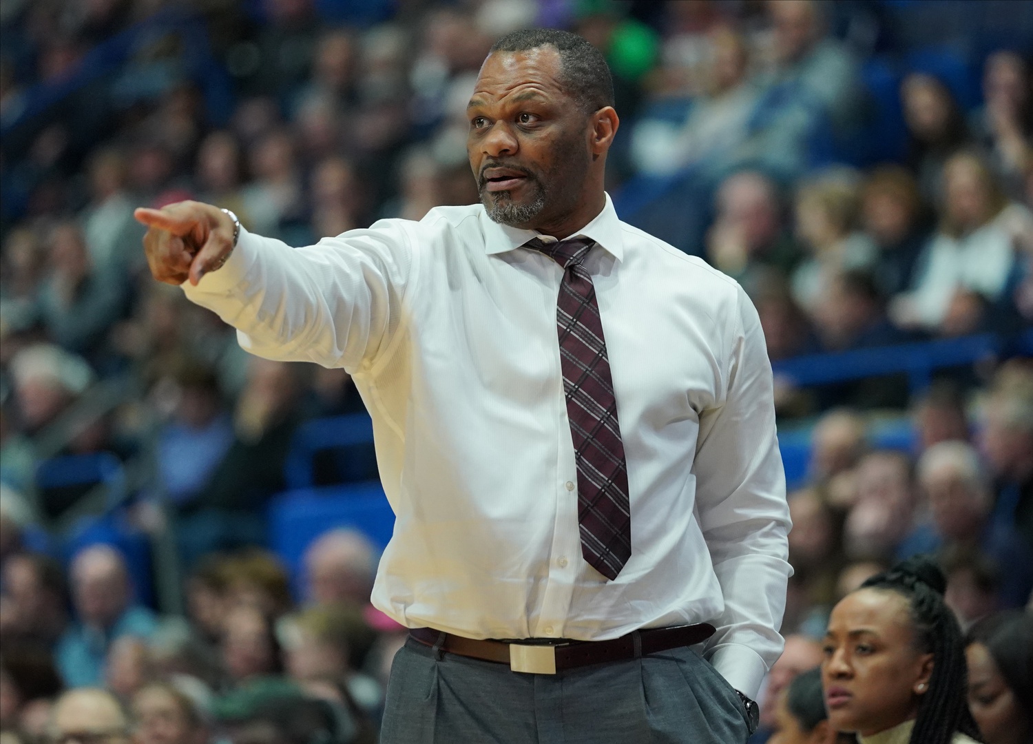 Houston Cougars head coach Ronald Hughey watches from the sideline as they take on the UConn Huskies in the second half at XL Center. UConn defeated Houston 91-51.