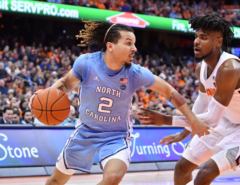 North Carolina Tar Heels guard Cole Anthony (2) works to get the ball past Syracuse Orange forward Quincy Guerrier in the second half at the Carrier Dome.