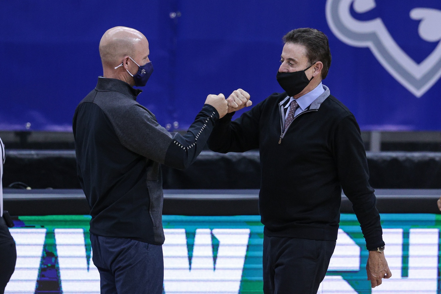 Seton Hall Pirates head coach Kevin Willard, left, fist bumps Iona Gaels head coach Rick Pitino after their game at Prudential Center.