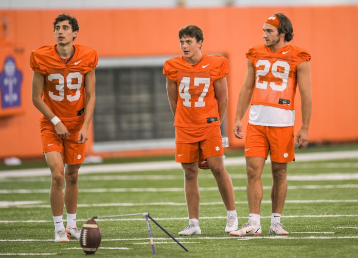 Aidan Swanson(39), left, kicker Hogan Morton (47), and kicker B.T. Potter(29) during practice