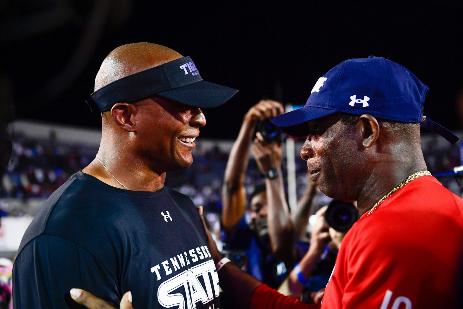 Tennessee State Coach Eddie George talks with Jackson State Coach Deion Sanders