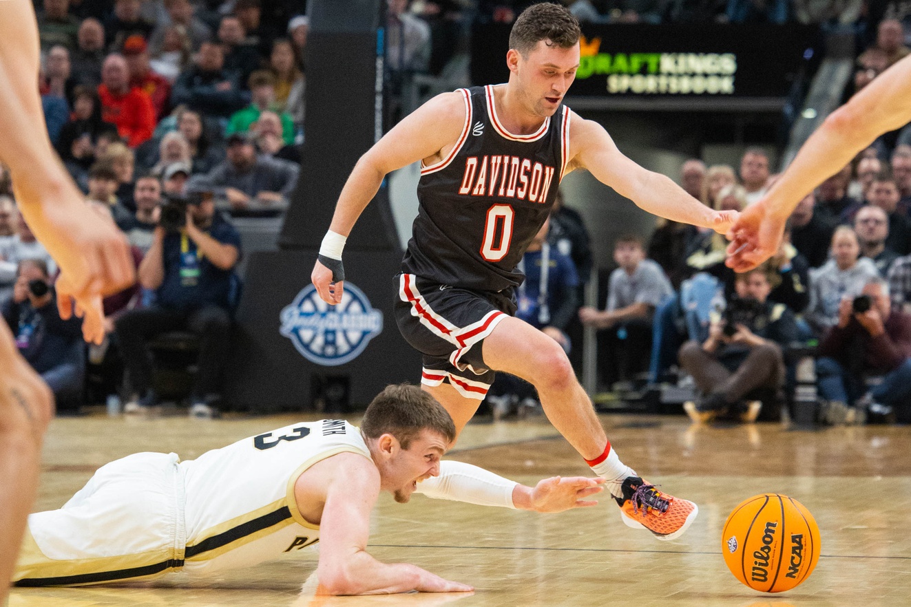 Purdue Boilermakers guard Braden Smith (3) and Davidson Wildcats guard Foster Loyer (0)