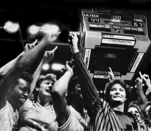 Lady Vols head coach Pat Summitt leads the cheers after winning the Women's NCAA National Championship 67-44 against Louisiana Tech. Celebrating with Summitt are players, from left, Melissa McCary, Kathy Spinks, Bridgette Gordon, and Dawn Marsh. The victory earned the Lady Vols their first national championship.