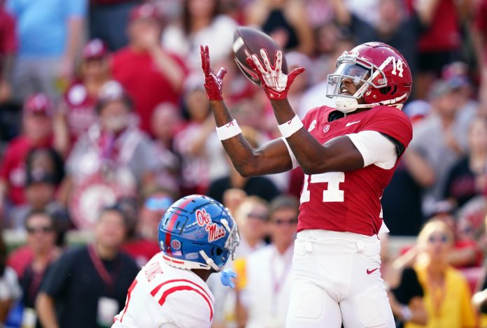 Alabama Crimson Tide wide receiver Jalen Hale (14) hauls in a 33-yard touchdown over Mississippi Rebels safety Isheem Young (1) during the third quarter at Bryant-Denny Stadium.