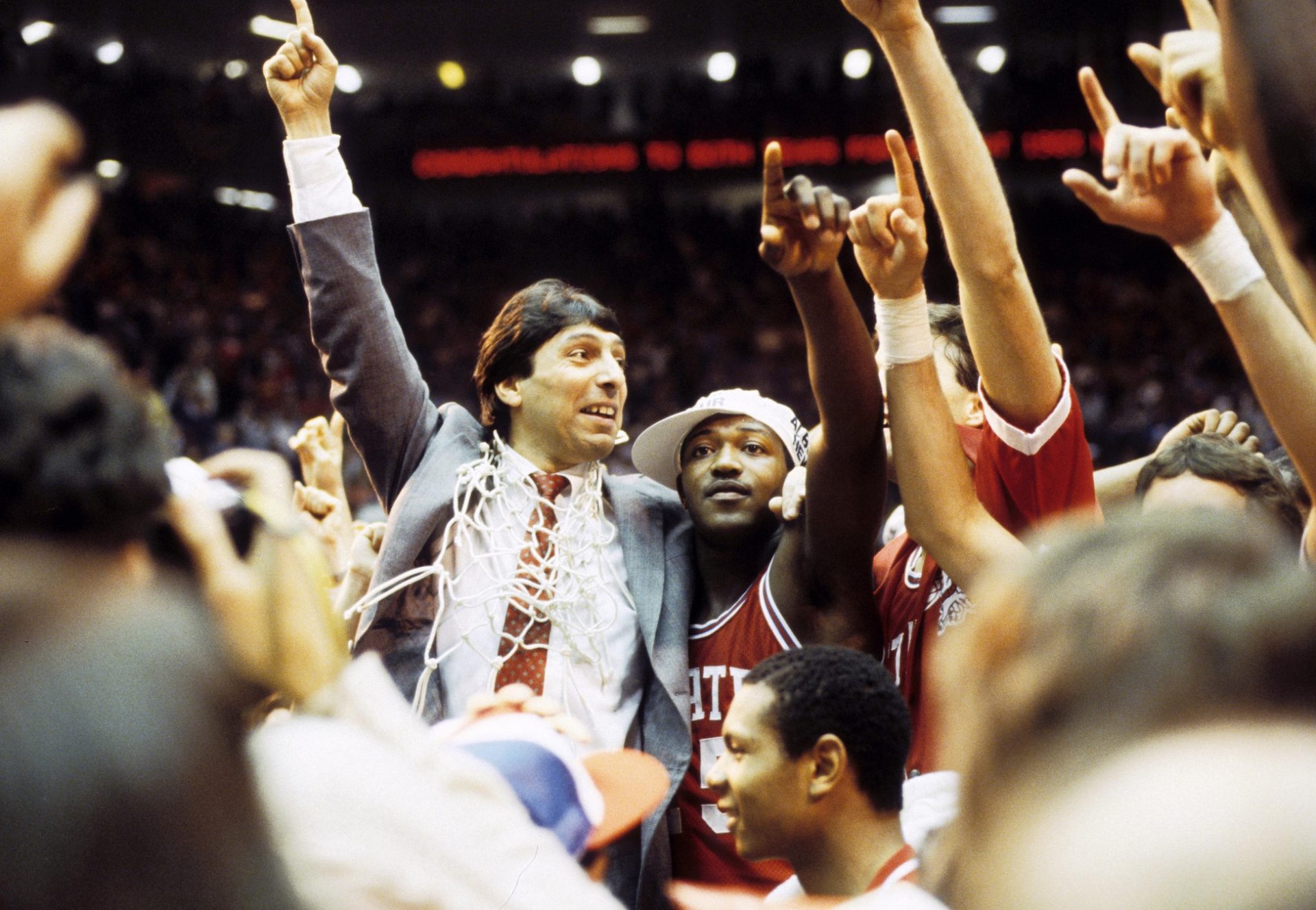 North Carolina State head coach Jim Valvano celebrates his teams victory over Houston in the 1983 Final Four. NC State defeated Houston 54-52.