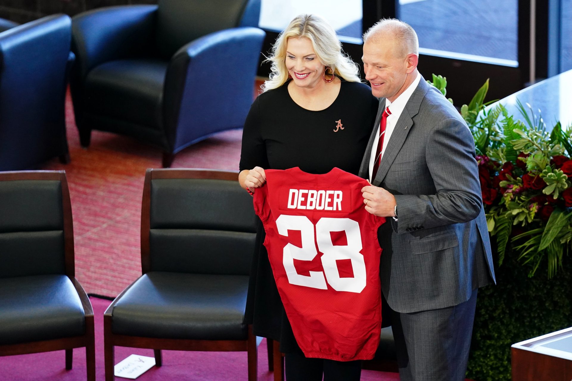 Kalen DeBoer and his wife Nicole DeBoer pose for a photo after he was introduced as the new head football coach for University of Alabama during a press conference in the North end zone at Bryant-Denny Stadium.