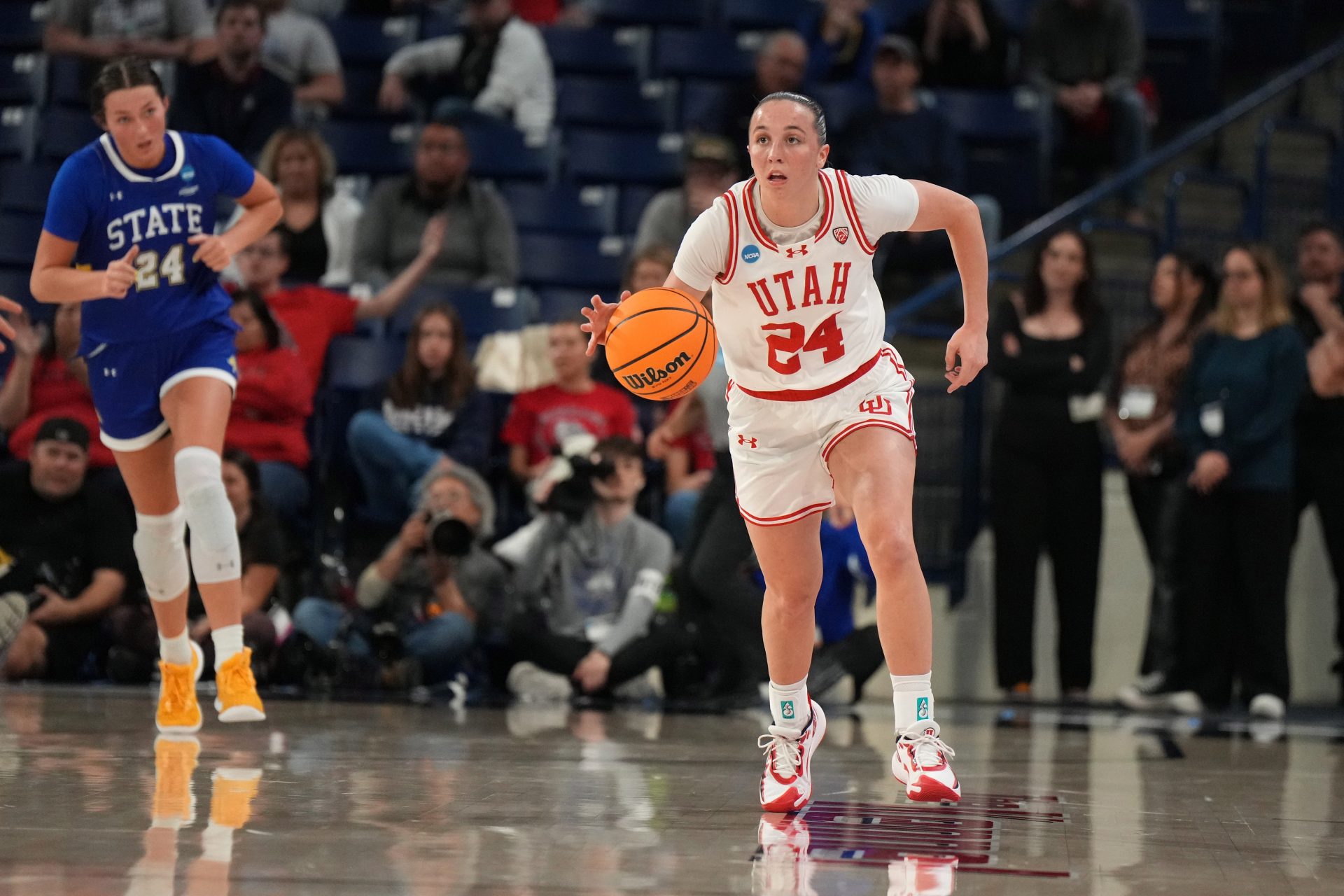 Utah Utes guard Kennady McQueen (24) dribbles the ball against the South Dakota State Jackrabbits during the second half at McCarthey Athletic Center.