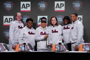 South Carolina Gamecocks coach Dawn Staley poses with staff after being named as the AP Coach of the Year at a press conference at Rocket Mortgage FieldHouse. From left: assistant coaches Mary Wooley and Jolette Law, Staley, associate head coach Lisa Boyer and assistant coaches Khadijah Sessions and Winston Gandy.