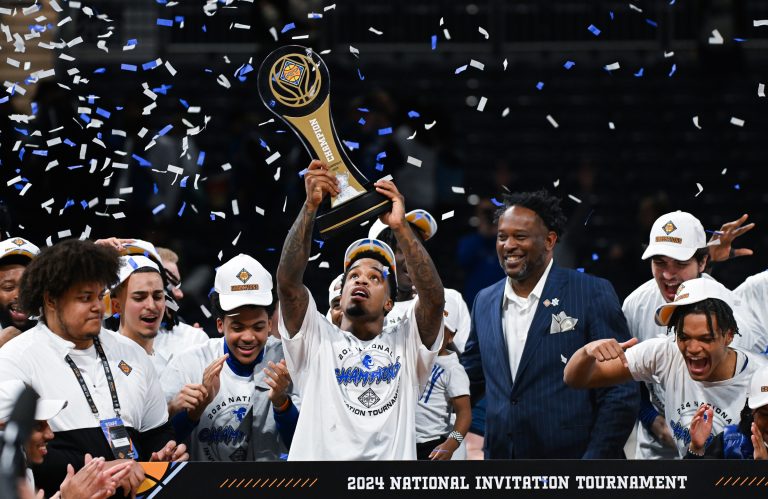 Seton Hall Pirates guard Al-Amir Dawes (2) celebrates with the trophy after defeating the Indiana State Sycamores at Hinkle Fieldhouse.