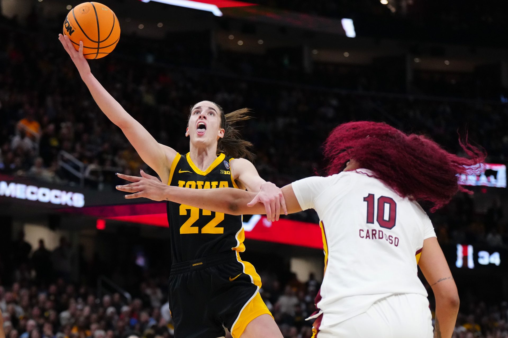 Iowa Hawkeyes guard Caitlin Clark (22) shoots against South Carolina Gamecocks center Kamilla Cardoso (10) in the second quarter in the finals of the Final Four of the womens 2024 NCAA Tournament at Rocket Mortgage FieldHouse.