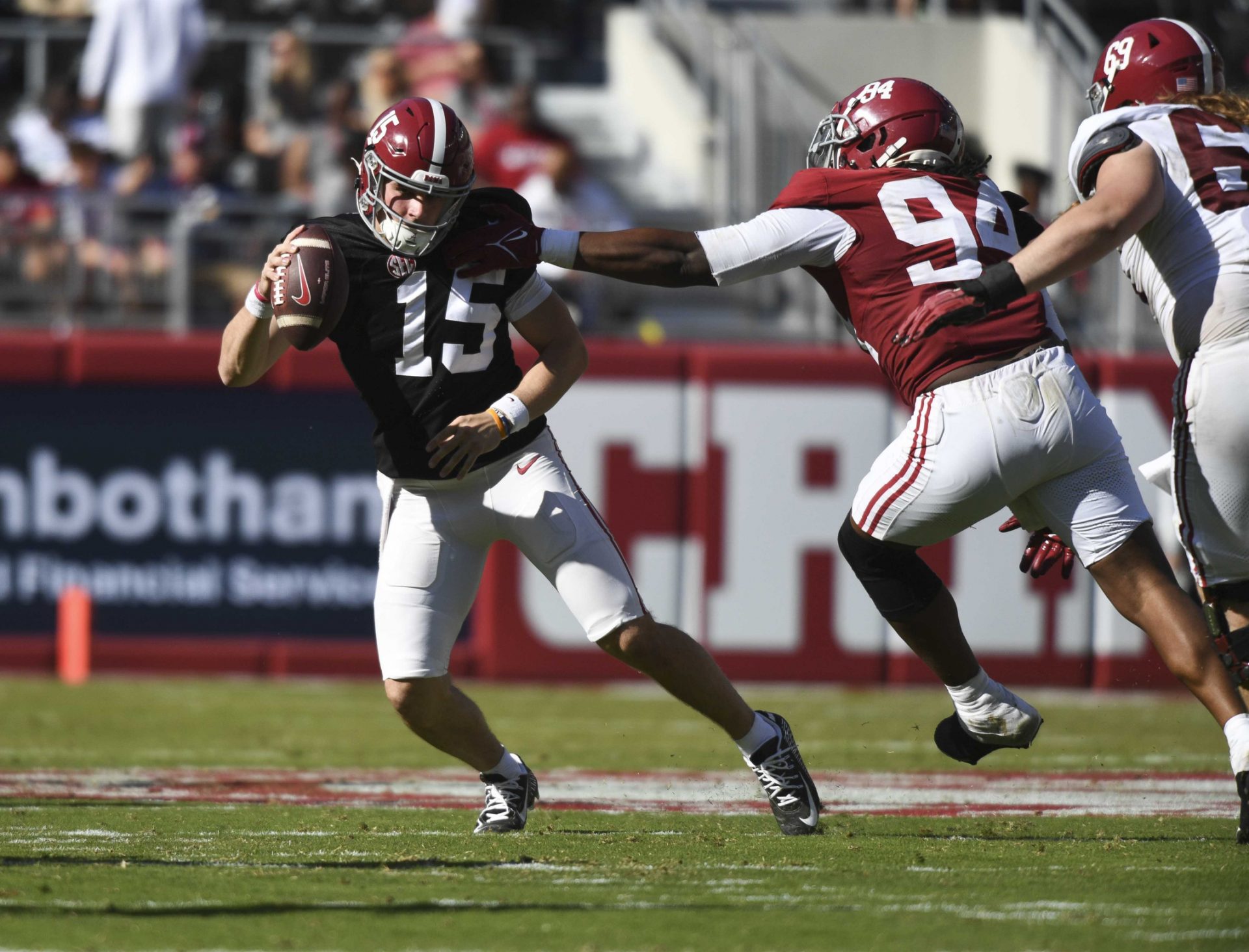 Alabama quarterback Ty Simpson (15) is tagged for a sack by Alabama defensive lineman Edric Hill (94) at Bryant-Denny Stadium.