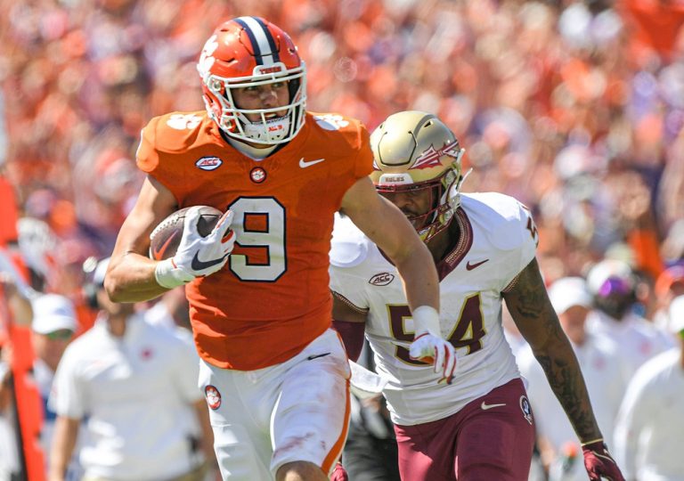 Clemson tight end Jake Briningstool (9) makes a catch near Florida State University defensive lineman Byron Turner Jr. (54) during the second quarter Sep 23, 2023; Clemson, South Carolina, USA; at Memorial Stadium.