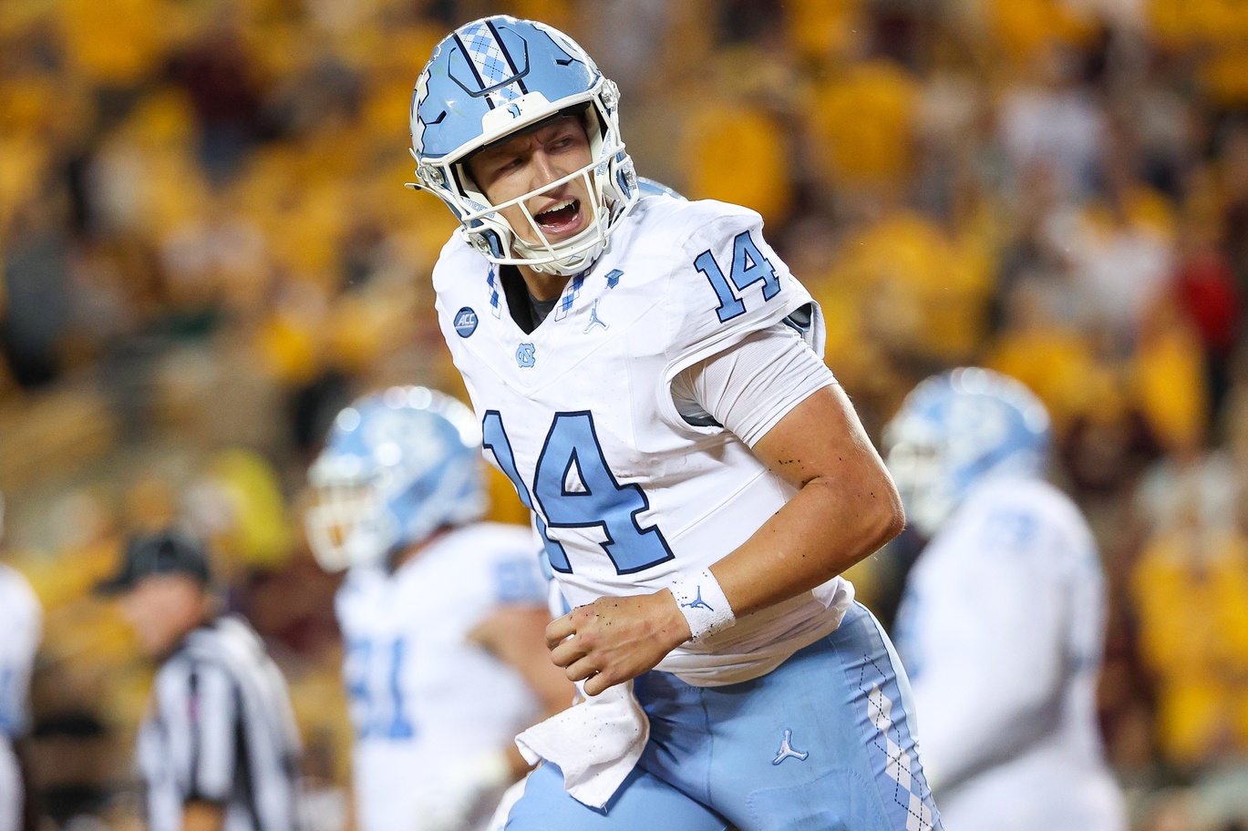 North Carolina Tar Heels quarterback Max Johnson (14) celebrates his rushing touchdown against the Minnesota Golden Gophers during the first half at Huntington Bank Stadium.