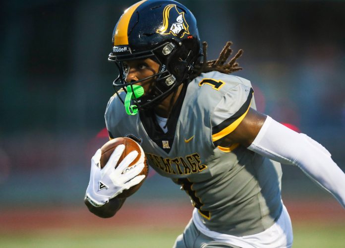 American Heritage Patriots receiver Malachi Toney (1) runs the ball during the first quarter of a game against the Naples Golden Eagles