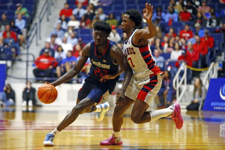 South Alabama Jaguars forward Barry Dunning Jr. (22) drives to the basket as Mississippi Rebels guard Davon Barnes (7) defends during the second half at C.M. 'Tad' Smith Coliseum.