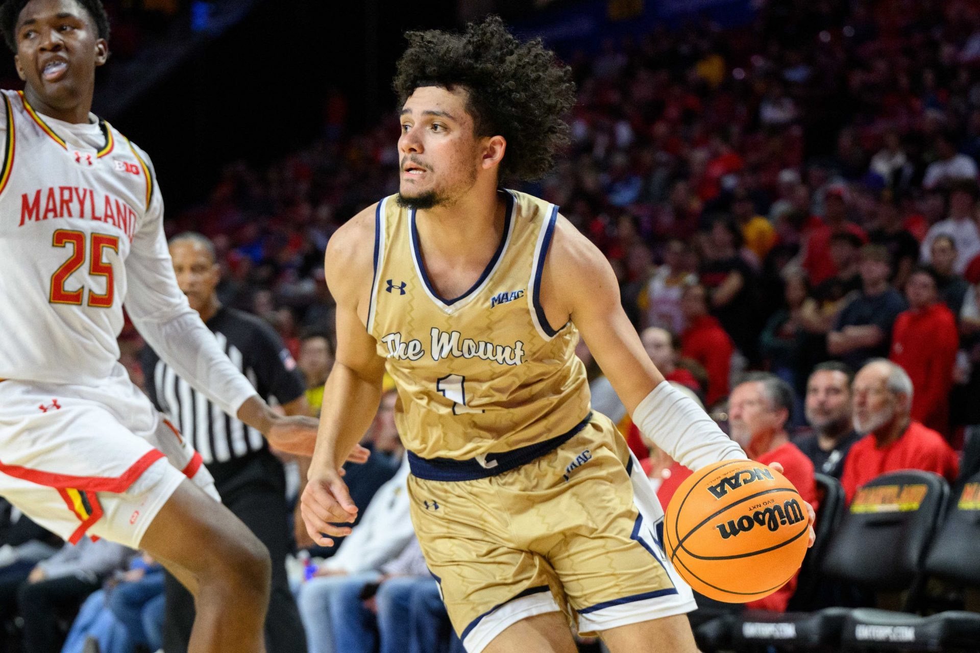 Mount St. Mary's Mountaineers guard Carmelo Pacheco (1) drives to the basket during the first half against Maryland Terrapins center Derik Queen (25) at Xfinity Center.