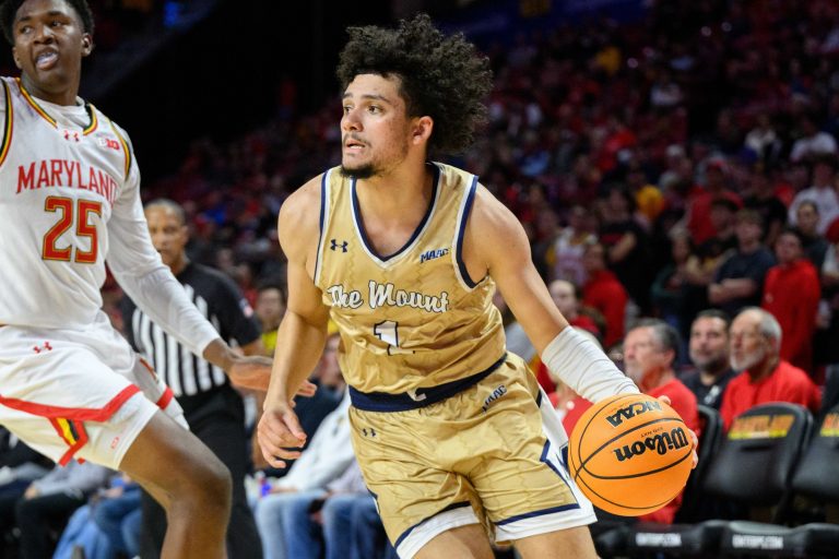 Mount St. Mary's Mountaineers guard Carmelo Pacheco (1) drives to the basket during the first half against Maryland Terrapins center Derik Queen (25) at Xfinity Center.